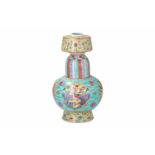 A polychrome porcelain bumba vase, decorated with cartouches with dragon and phoenix. Marked with