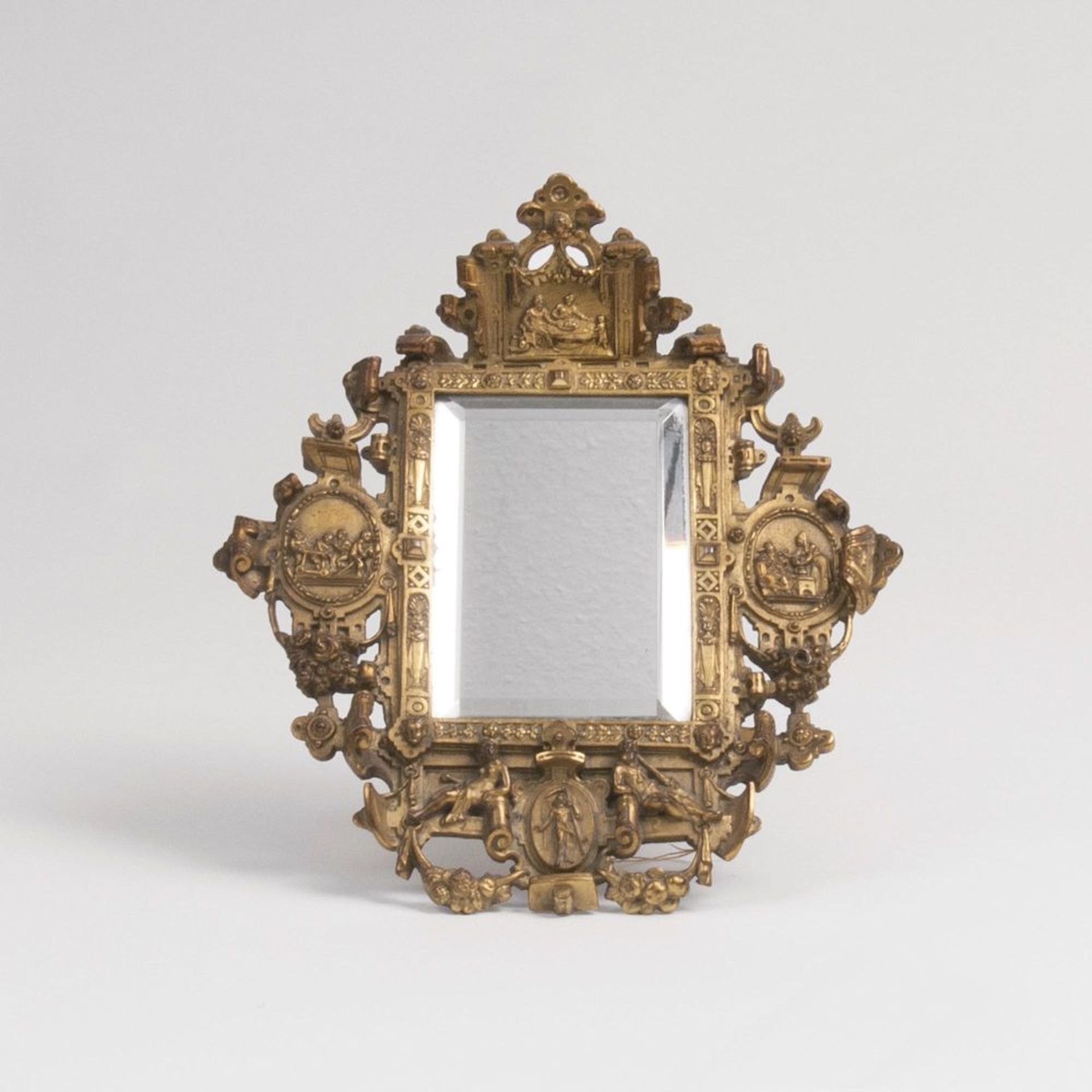 A Small Bronze Mirror with reliefs of the four ages