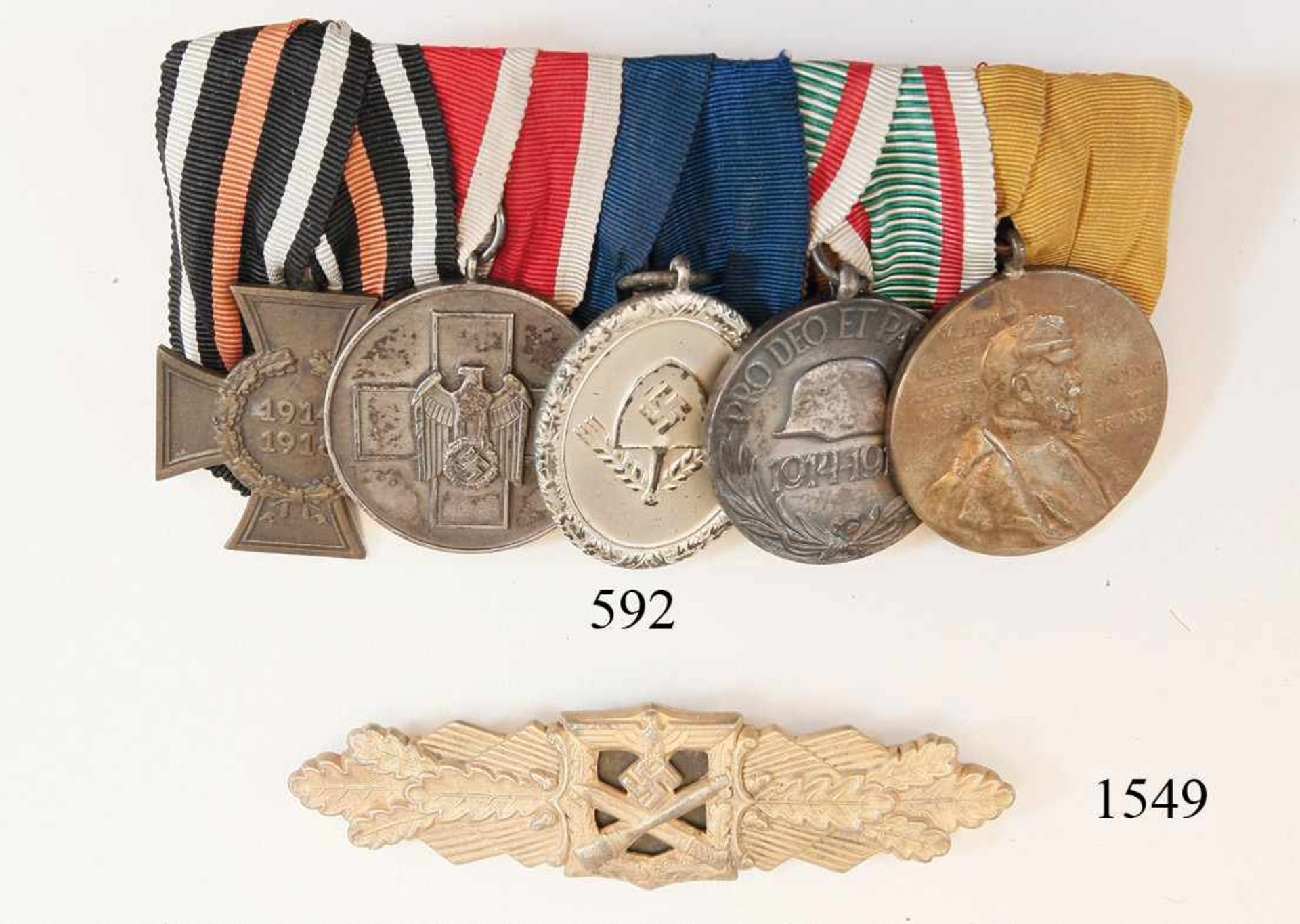 Ordenspange mit 5 DekorationenTeilnehmerkreuz. Volkspflegemedaille. RAD Dienstauszeichung für 12