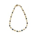 A SAPPHIRE AND DIAMOND NECKLACE each backed cabochon tube-set sapphire linked with a bouquet of 4