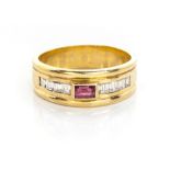 A RUBY AND DIAMOND RING centred by a tube-set baguette-cut ruby, flanked by 4 baguette-cut diamonds,