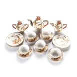 A JAPANESE EXPORT SATSUMA PART TEA SERVICE, 21ST CENTURY depicting dragons amongst clouds with