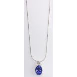 A TANZANITE AND DIAMOND PENDANT the claw-set oval mixed-cut tanzanite surmounted by a claw-set round