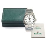 A MID SIZE STAINLESS STEEL WRISTWATCH, ROLEX OYSTER PERPETUAL manual, the circular white dial