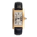 A LADY'S GOLD WRISTWATCH, CARTIER TANK AMERICAINE automatic, the cream rectangular dial with Roman