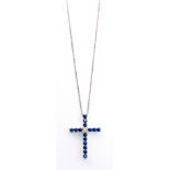 A DIAMOND AND SAPPHIRE PENDANT in the shape of a cross set with claw-set circular mixed-cut