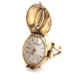 A LADY'S 9CT GOLD DIAMOND WATCH/RING, NIVADA the silvered oval dial with gilt baton hour markers,