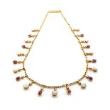 A RUBY, OPAL AND SEED PEARL NECKLACE each round claw-set seed pearl above a round claw-set