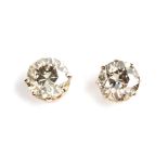 A PAIR OF DIAMOND STUDS each claw-set with a round old-cut diamond, weighing approximately 1,3cts in