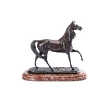 A BRONZE HORSE AFTER PIERRE JULES MÊNE (1810 - 1879), 20TH CENTURY in mid-stride, on a red-veined
