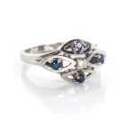 A SAPPHIRE AND DIAMOND RING centred by a claw-set round eight-cut diamond, weighing approximately