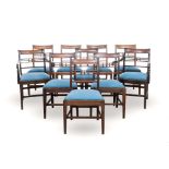 A SET OF TEN REGENCY WALNUT DINING CHAIRS comprising: a pair of carvers and eight side chairs;