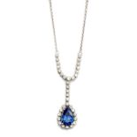 A TANZANITE AND DIAMOND PENDANT centred by a claw-set pear-cut tanzanite, weighing 2.11ct,