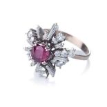 A RUBY AND DIAMOND RING claw-set to the centre with nine round brilliant-cut rubies weighing