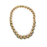 A GOLD AND TOURMALINE NECKLACE by Ricciardi of Buenos Aires, in a swirl-over design in 18ct gold,