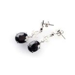 A PAIR OF SAPPHIRE AND DIAMOND EARRINGS claw-set to the centre with a pair of matching oval