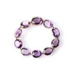 AN AMETHYST BRACELET Set with 10 oval faceted amethysts with a combined weight of apprximatky 41