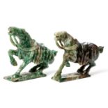 A NEAR PAIR OF CHINESE HARDSTONE HORSES Each semi-rearing horse carved saddled, with one leg raised,