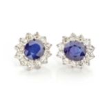 A PAIR OF SAPPHIRE AND DIAMOND EARRINGS (2) Claw set oval cut sapphire weighing approximately 9,78ct