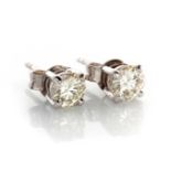 A PAIR OF DIAMOND STUDS Each claw set round brilliant cut diamond weighing approximately 1ct in