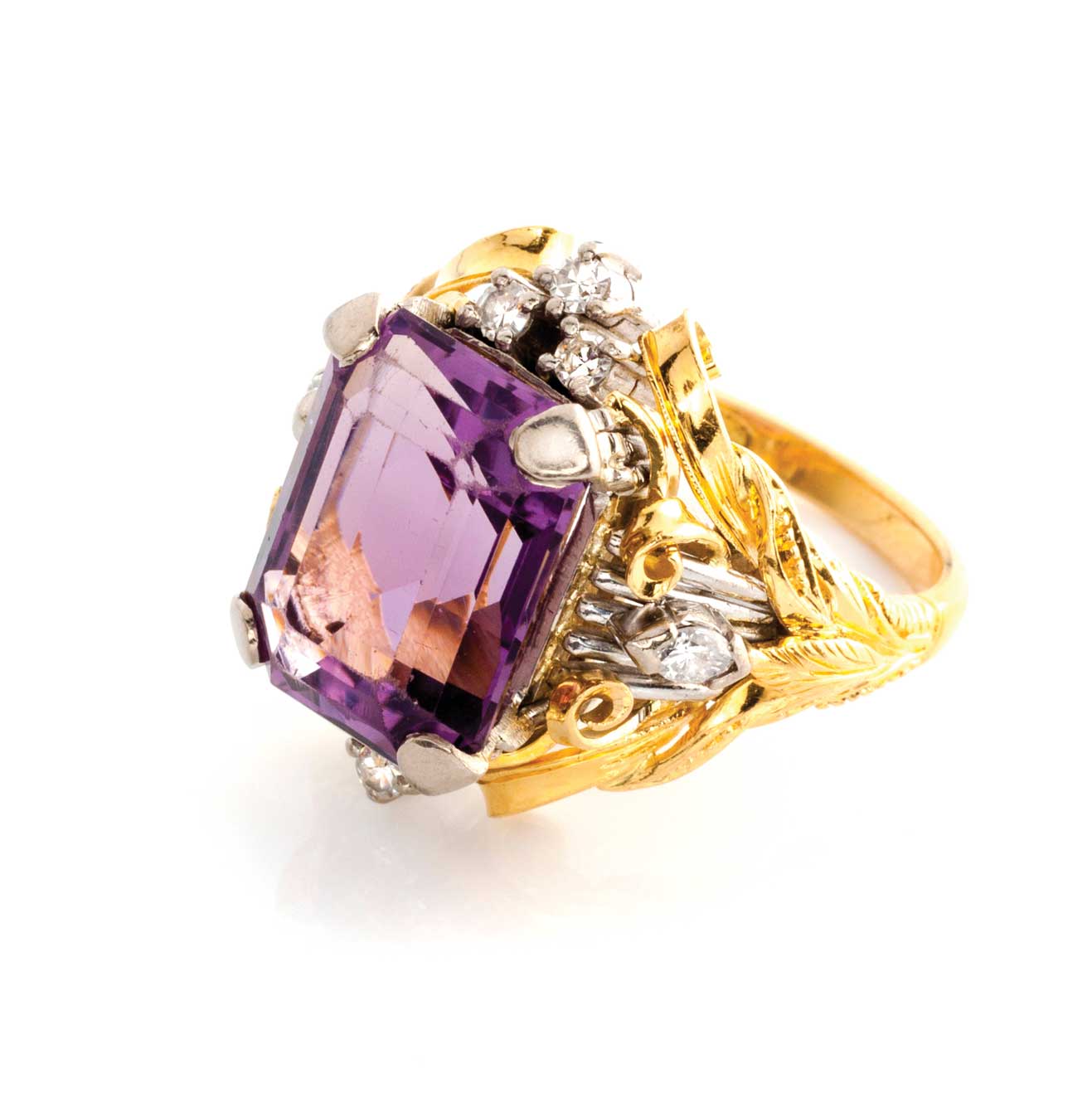 AN AMETHYST AND DIAMOND RING Claw set to the centre with an emerald-cut amethyst weighing