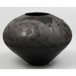 A CLAY POT, ZULU, signed and dated Shongwazi P.H. Magwazi,, 10/11/2003 Blackened clay vClay, 27cm