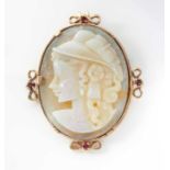 A GARNET AND OPAL CAMEO PENDANT BROOCH Carved as a woman in profile to sinister, the top, bottom and