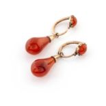 A PAIR OF GOLD AND CARNELIAN DROP EARRINGS each lever hook earring centred with a orb-shaped