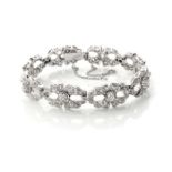 A DIAMOND BRACELET A diamond bracelet, early 20th century, each diamond encrusted link designed as a