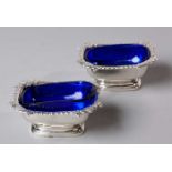 A PAIR OF GEORGE III SILVER SALTS, LONDON, 1810 Of rectangular form with gadrooned rim, the body