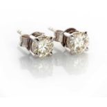 A PAIR OF DIAMOND EARRINGS (2) Each claw set round brilliant cut diamond weighing approximately 1,