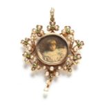 A VICTORIAN SEED PEARL AND PERIDOT PORTRAIT PENDANT Designed as a wreath of shamrocks and scrolls