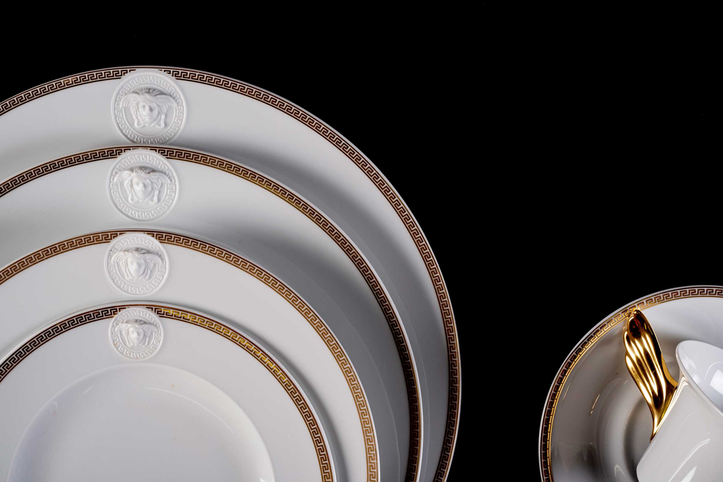 A ROSENTHAL VERSACE MEDALLION 'MEANDRE D'OR' PATTERN DINNER SERVICE