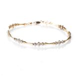 A DIAMOND AND GOLD BRACELET