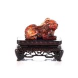 A CHINESE SOAPSTONE CARVING OF A LION DOG, REPUBLIC PERIOD, 1912 - 1949