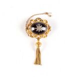 A VICTORIAN GOLD, GARNET AND DIAMOND MOURNING BROOCH