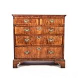 A GEORGE III WALNUT CHEST OF DRAWERS