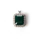 AN EMERALD AND DIAMOND PENDANT