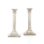 A PAIR OF SILVER CANDLESTICKS, BIRMINGHAM English, each modelled as a fluted column, each base