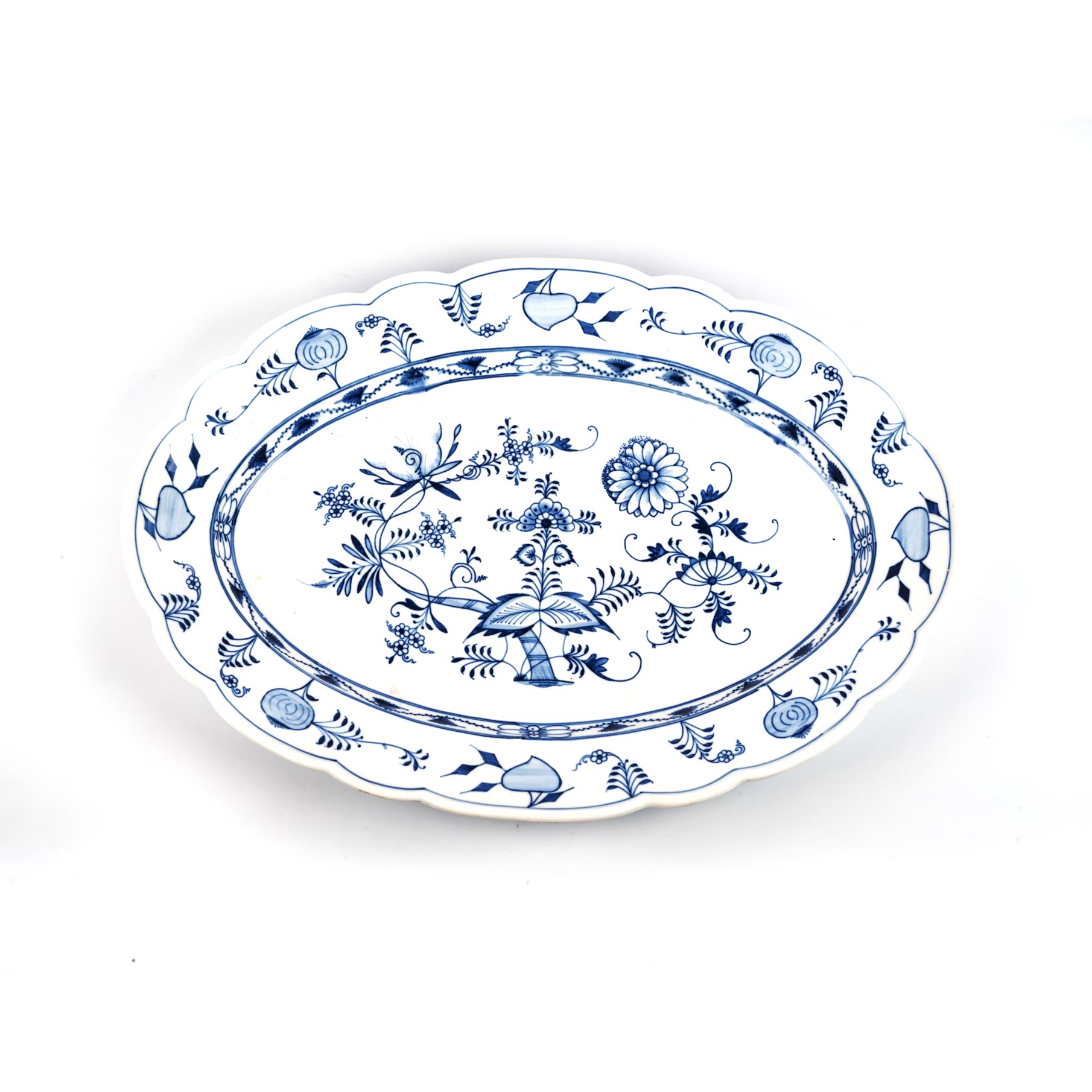 A BLUE AND WHITE MEISSEN PLATTER Blue and white fruit and flower motif, oval in shape with scalloped