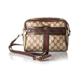 A GUCCI CROSSBODY HANDBAG Brown leather adjustable shoulder strap, canvas and leather with