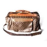 A LOUIS VUITTON TRAVEL BAG Brown leather with signature LV monogram stitched on leather, with canvas