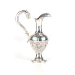 A PORTUGUESE SILVER JUG, OPORTO (1886 - 1938) The baluster body applied with moulded high relief,