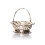 A SILVER FRUIT BASKET, COLLINGWOOD & CO, BIRMINGHAM, 1905 Oval with floral edging and scrolled