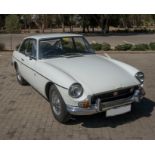 A 1972 MGB GT Colour white with original blue interior, wire wheels, overdrive. The car is in very