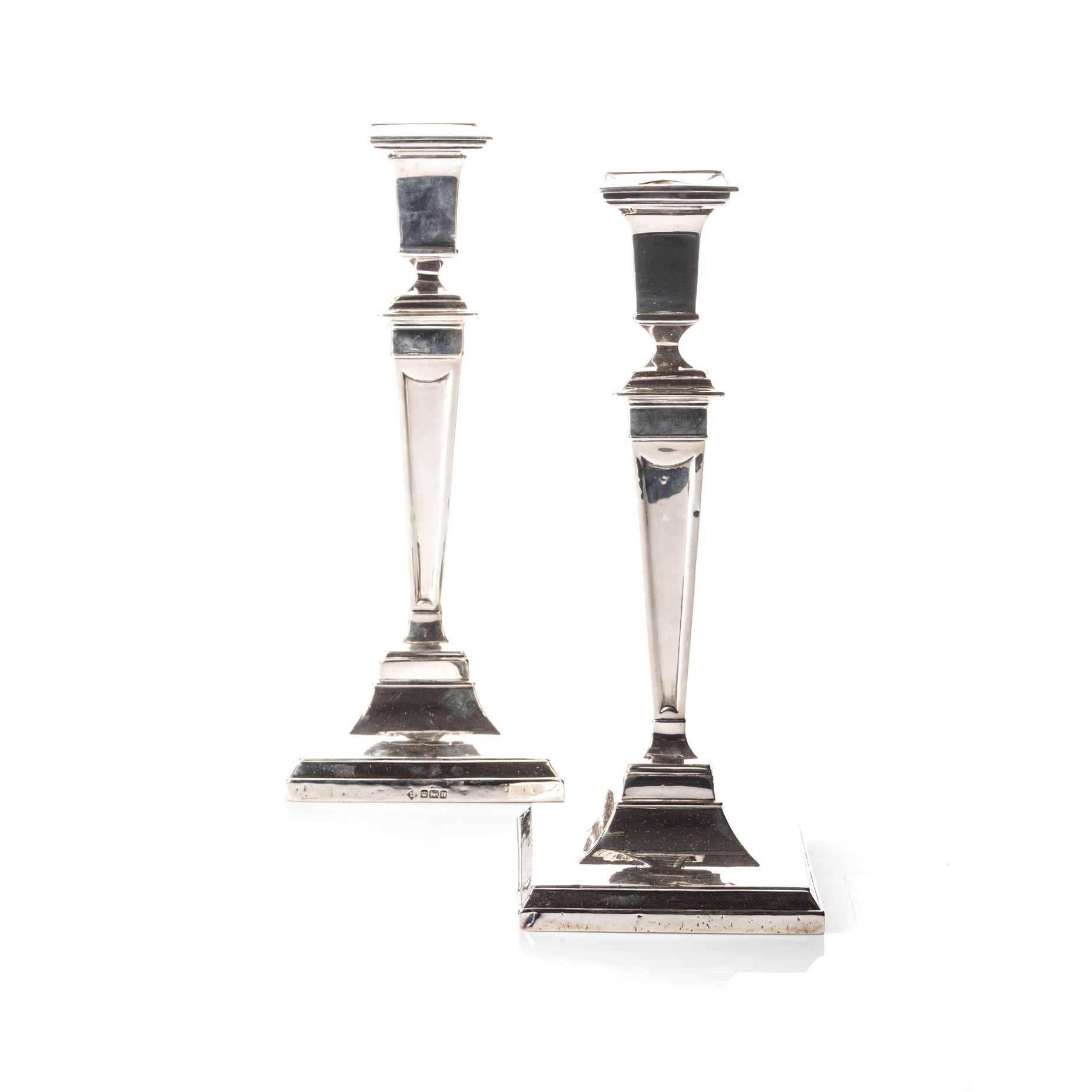 A PAIR OF SILVER CANDLESTICKS, MAKERS MARK R.M.E.H, BIRMINGHAM, 20TH CENTURY Each geometric tapering