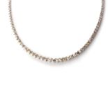 A DIAMOND TENNIS NECKLACE Tapered, claw-set to the centre with 31 round brilliant-cut diamonds,