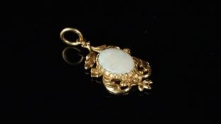 Opal pendant, oval opal set within a 9ct yellow gold floral surround, approximate weight 3.2 grams.