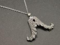 Diamond set wing design pendant, mounted in unmarked white metal, set with old cut and rose cut