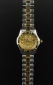 LADIES' TAG HEUER PROFESSIONAL WRISTWATCH, circular gold dial with luminous hour markers and a